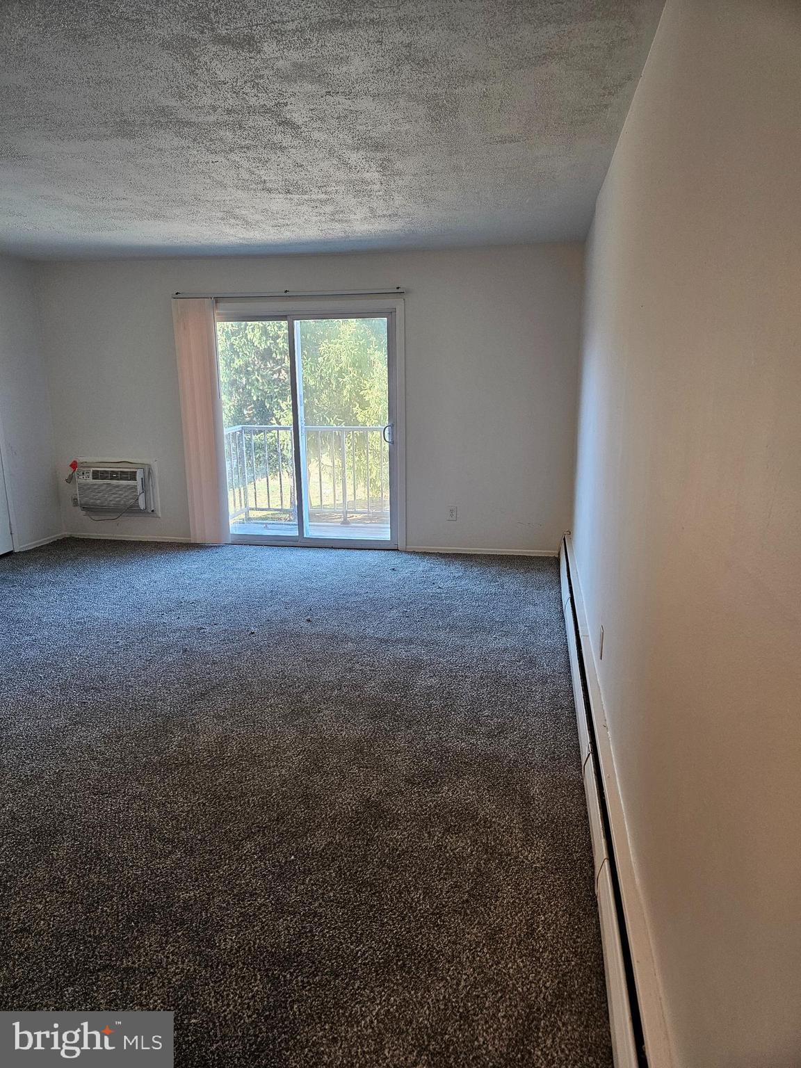 777 Cherry Tree Road, Unit 102 Upper Chichester, PA 19014 - Photo 2 of 6 en empty room with windows