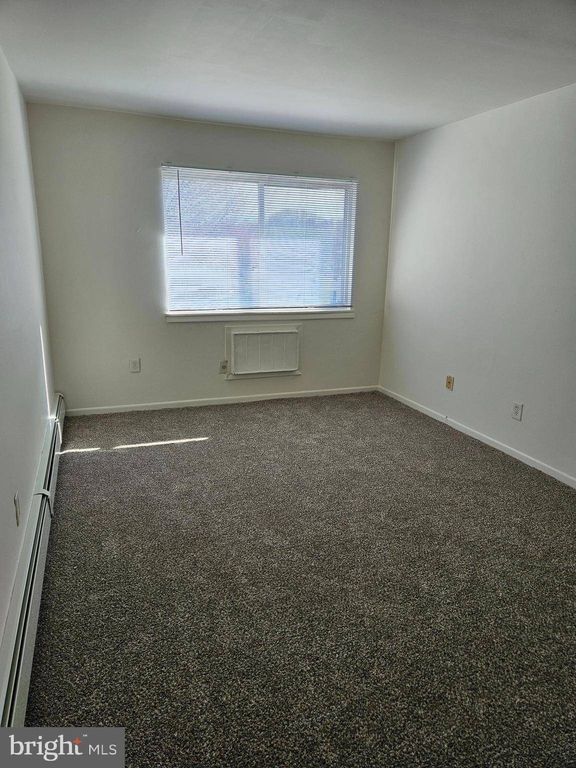 777 Cherry Tree Road, Unit 102 Upper Chichester, PA 19014 - Photo 3 of 6 an empty room with a window
