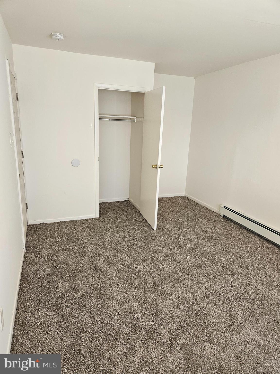 777 Cherry Tree Road, Unit 102 Upper Chichester, PA 19014 - Photo 4 of 6 an empty room with an entryway