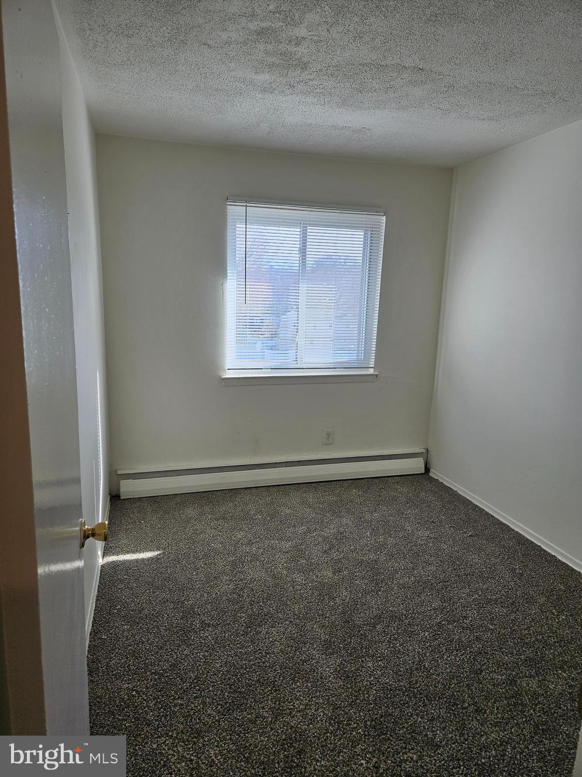 777 Cherry Tree Road, Unit 102 Upper Chichester, PA 19014 - Photo 5 of 6 an empty room with a window
