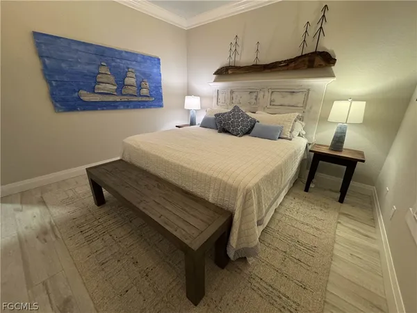 a bedroom with a bed and a night stand