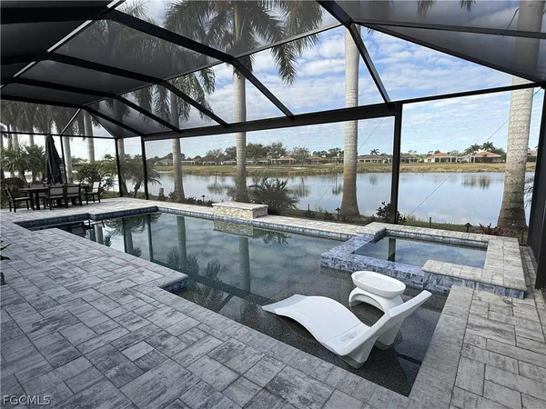a view of a swimming pool with a lounge chairs