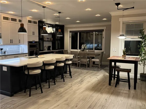 a view of a dining area with furniture and wooden floor