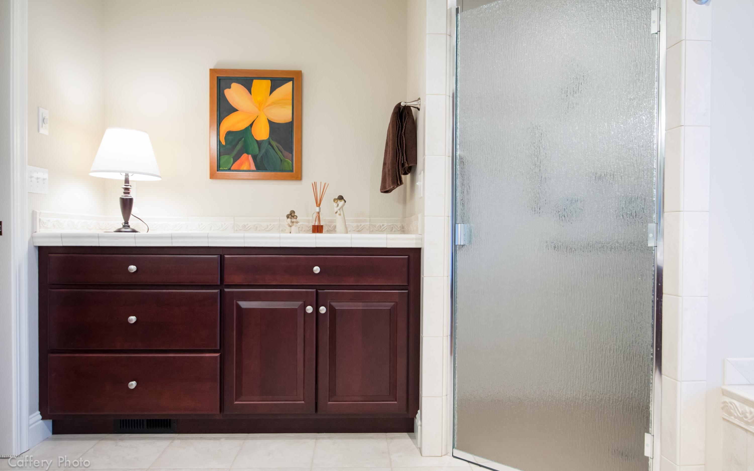 1271 Lateral B Road Wapato, WA 98951 - Photo 16 of 32 a bathroom with a sink vanity and a mirror