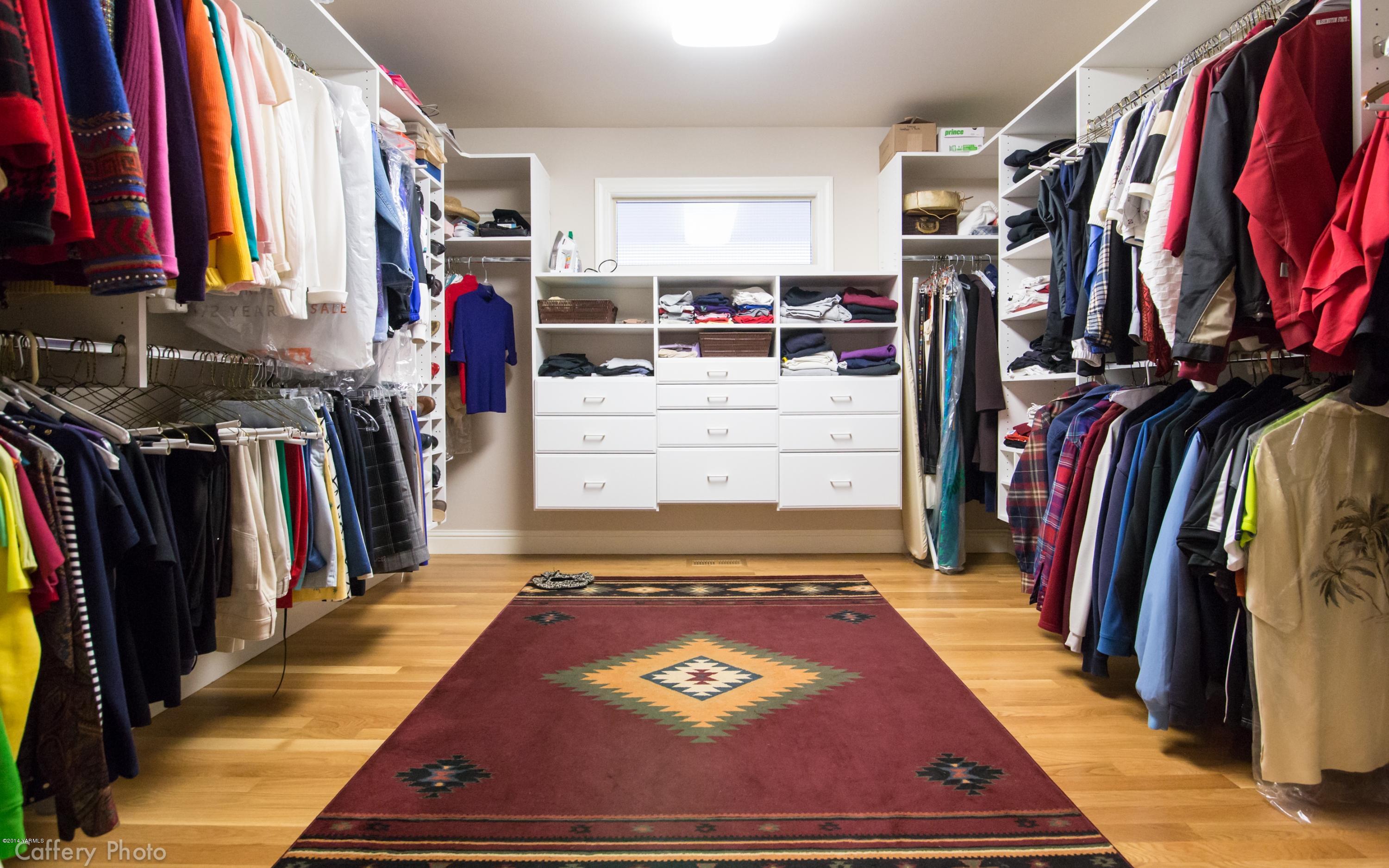 1271 Lateral B Road Wapato, WA 98951 - Photo 18 of 32 a view of walk in closet with clothes and shoes