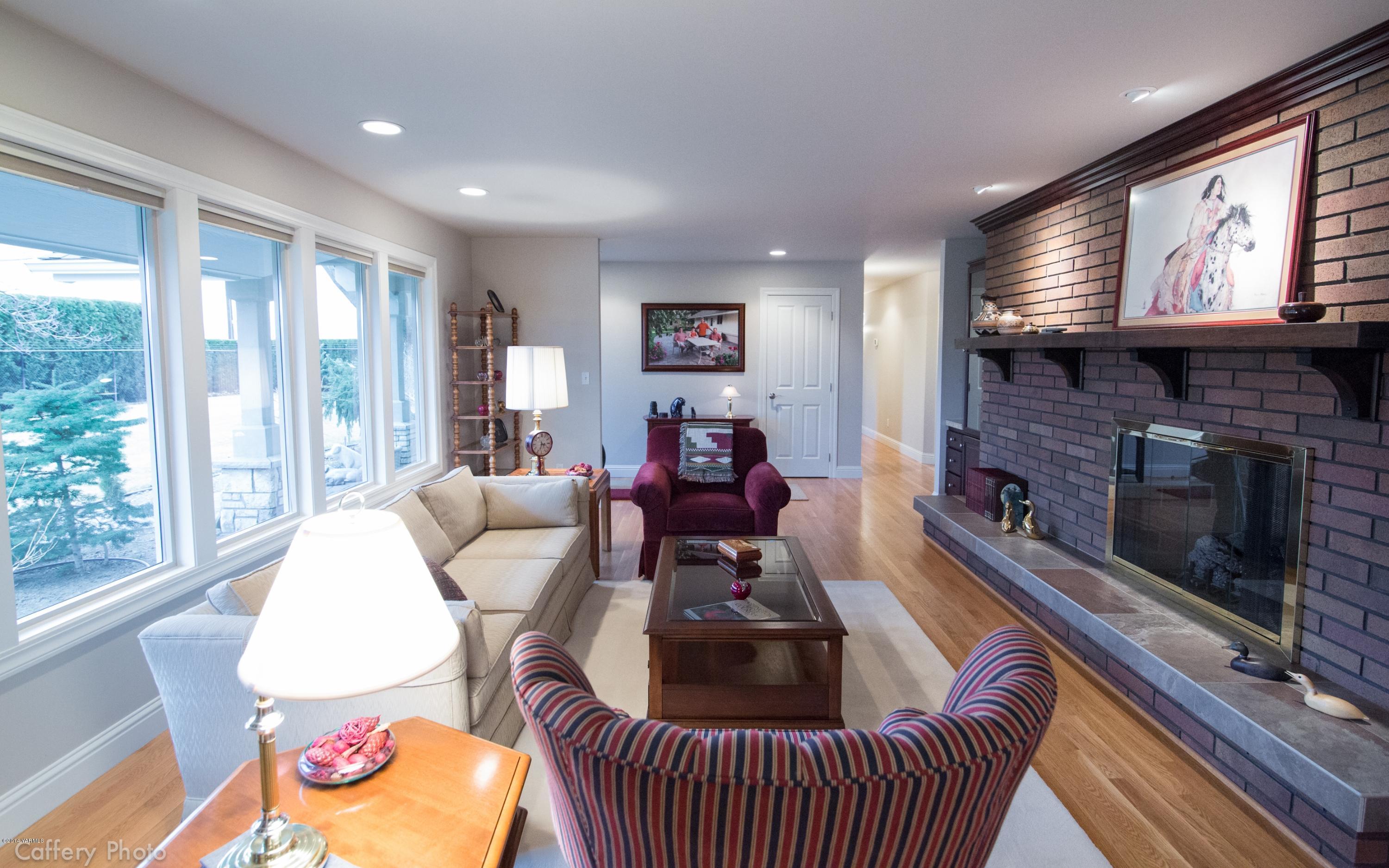 1271 Lateral B Road Wapato, WA 98951 - Photo 6 of 32 a living room with furniture and a fireplace