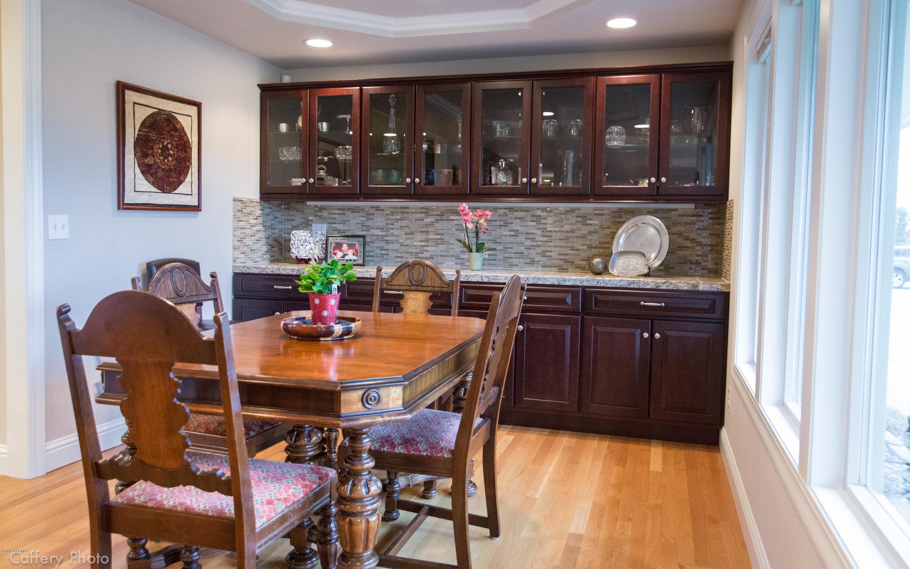 1271 Lateral B Road Wapato, WA 98951 - Photo 7 of 32 a dining room with a table and chairs