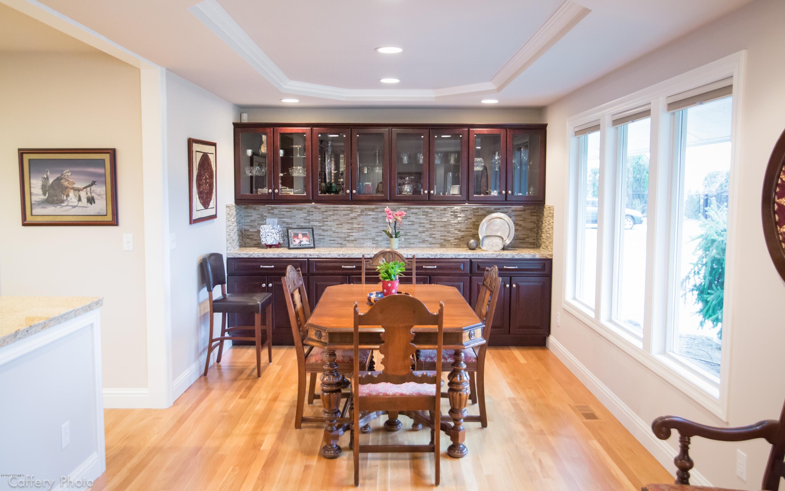 1271 Lateral B Road Wapato, WA 98951 - Photo 8 of 32 a view of a dining room with furniture window and wooden floor