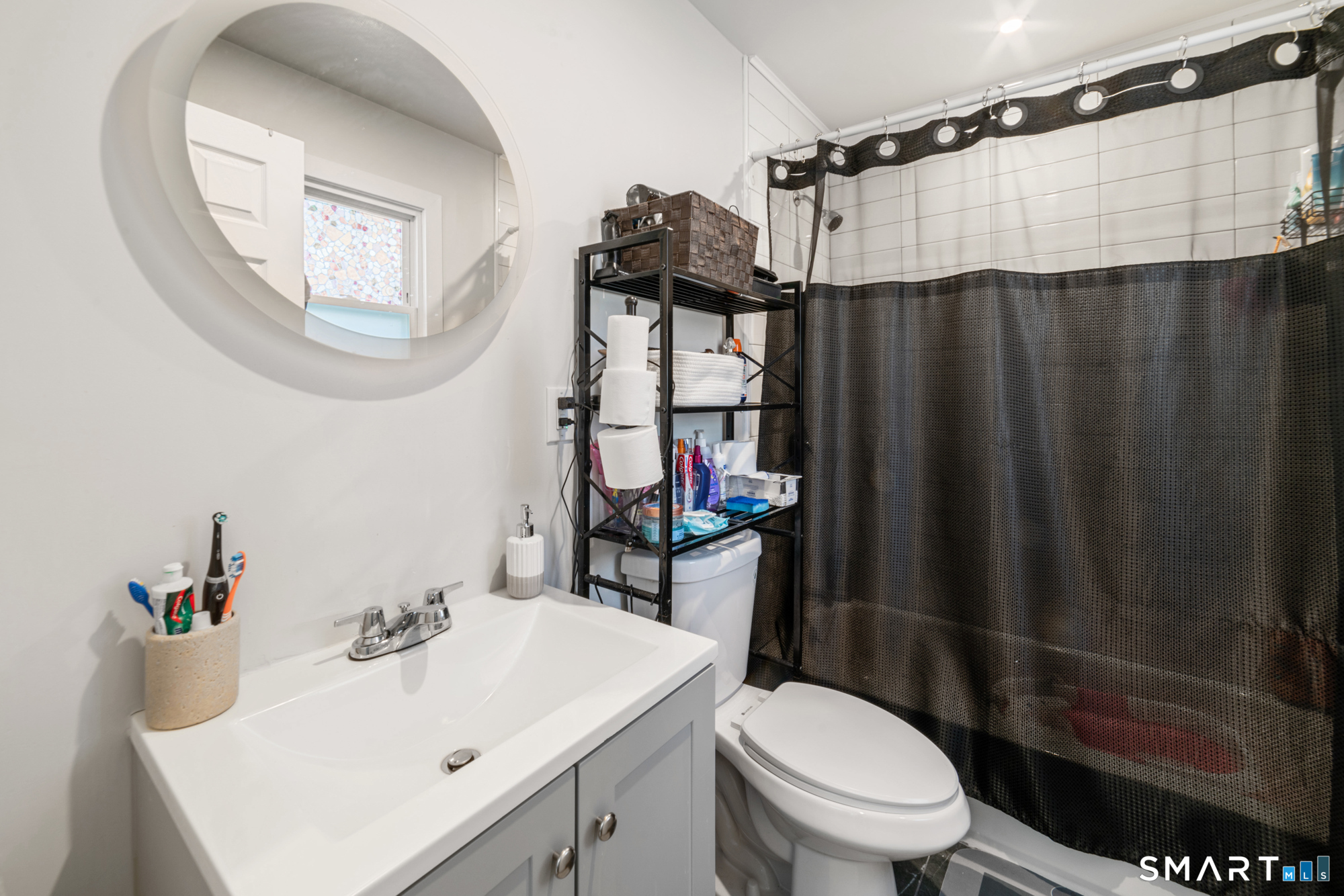 327 Lakeside Boulevard West Waterbury, CT 06708 - Photo 12 of 29 a bathroom with a sink toilet and shower