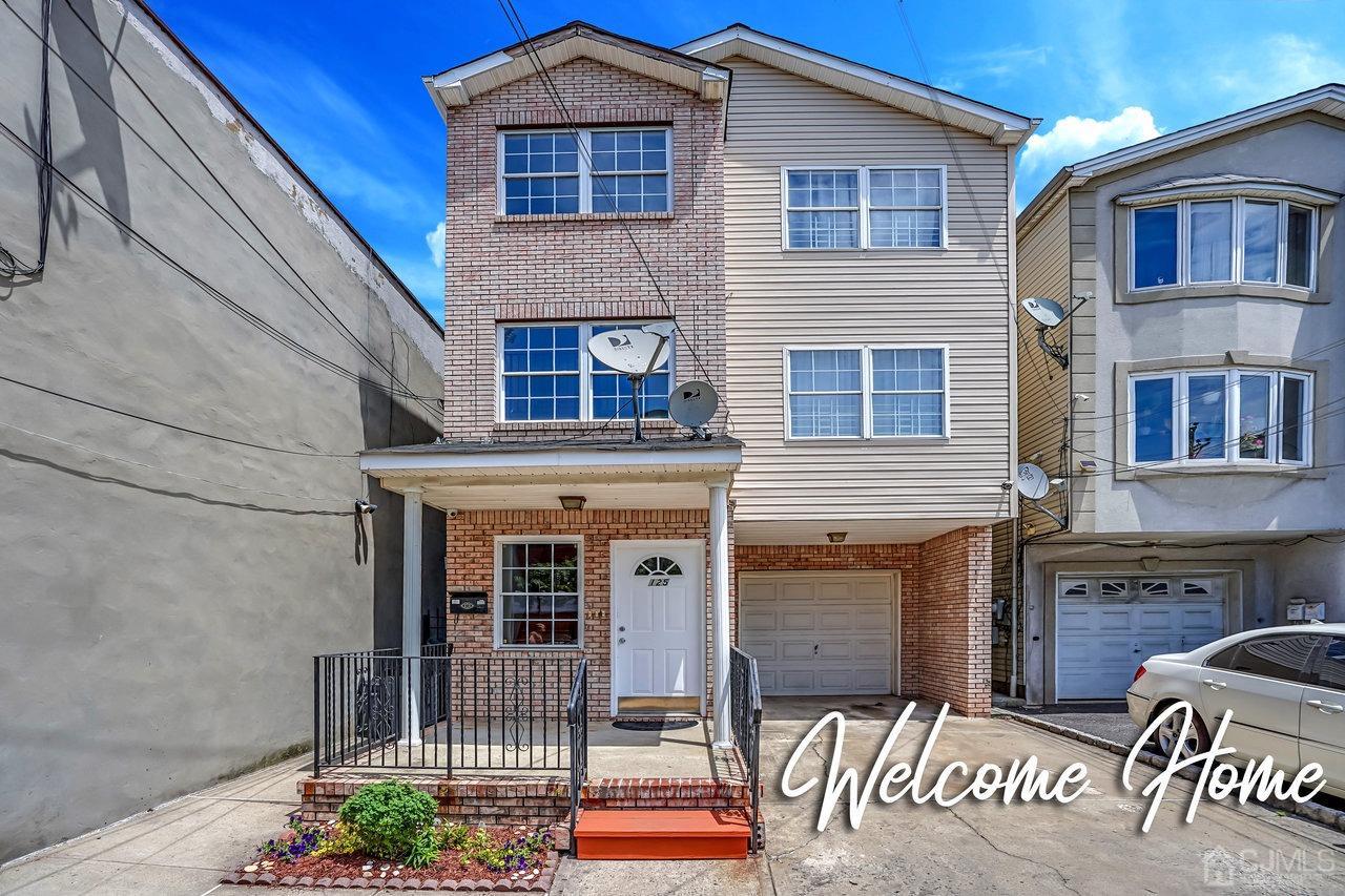 a front view of a house with a yard