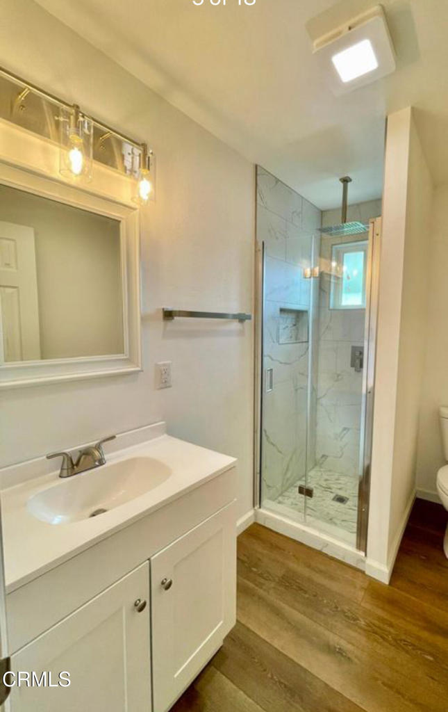 403 East 2nd Street Oxnard, CA 93030 - Photo 4 of 6 a bathroom with a sink and a mirror