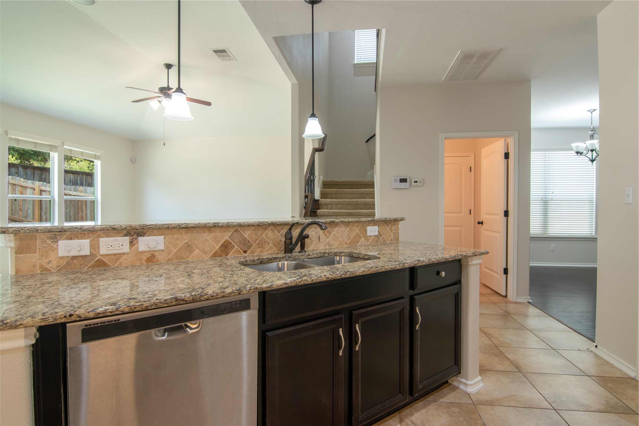 12104 Broten Street Austin, TX 78748 - Photo 11 of 32 A well-appointed kitchen island with granite countertops and stainless steel appliances awaits.