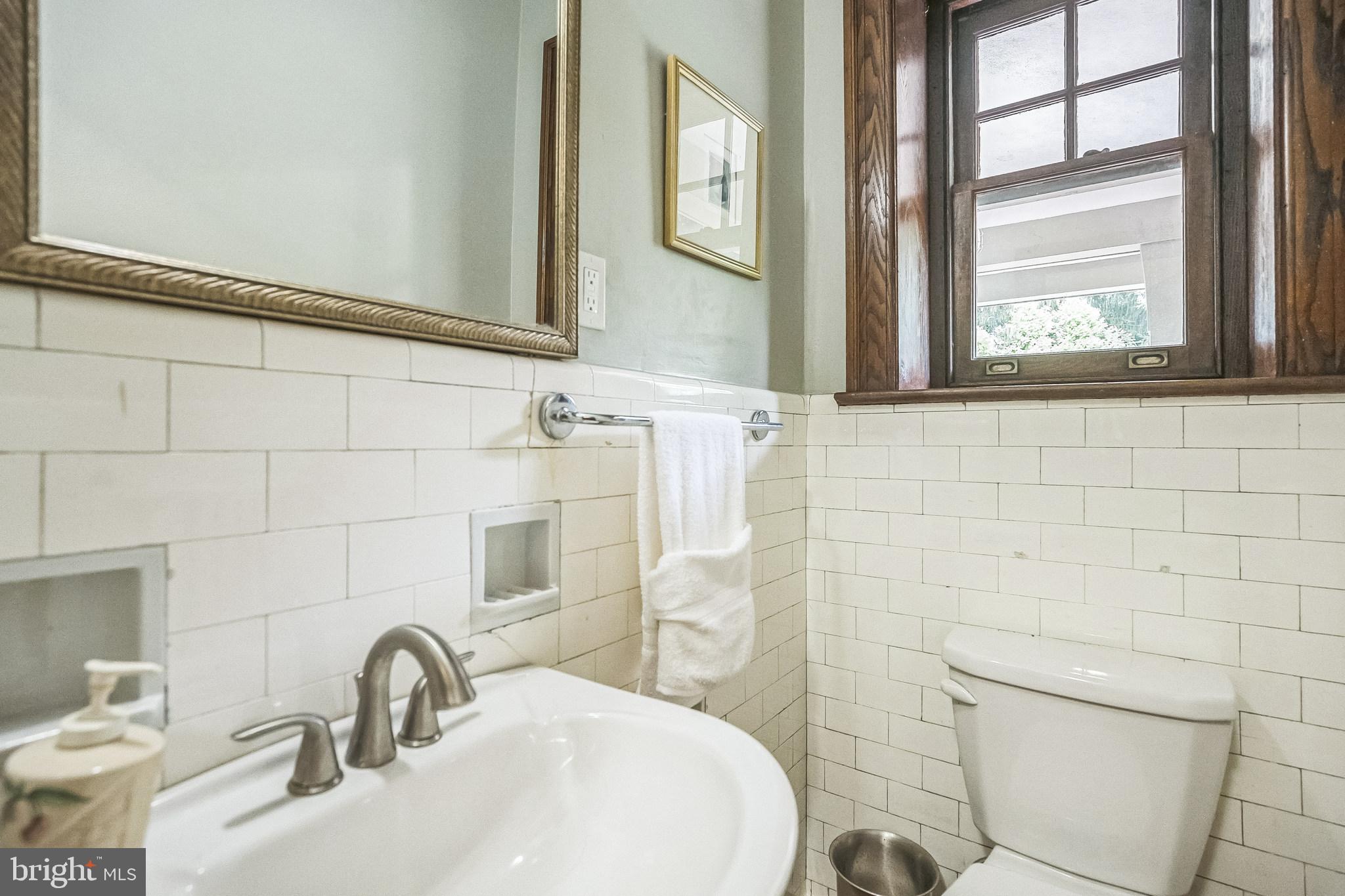 102 Maple Avenue Wyncote, PA 19095 - Photo 13 of 30 a bathroom with a sink a toilet and a mirror