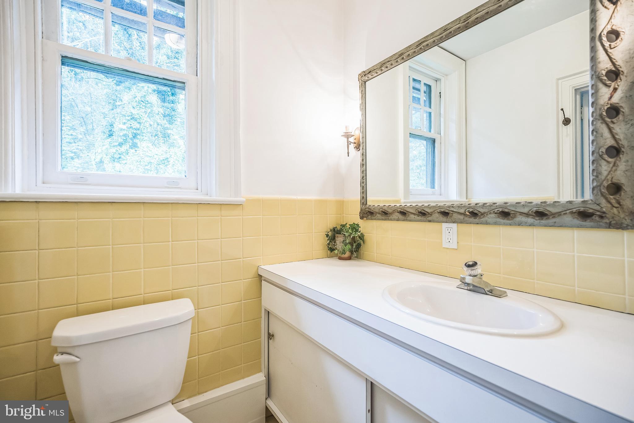 102 Maple Avenue Wyncote, PA 19095 - Photo 15 of 30 a bathroom with a toilet sink and mirror