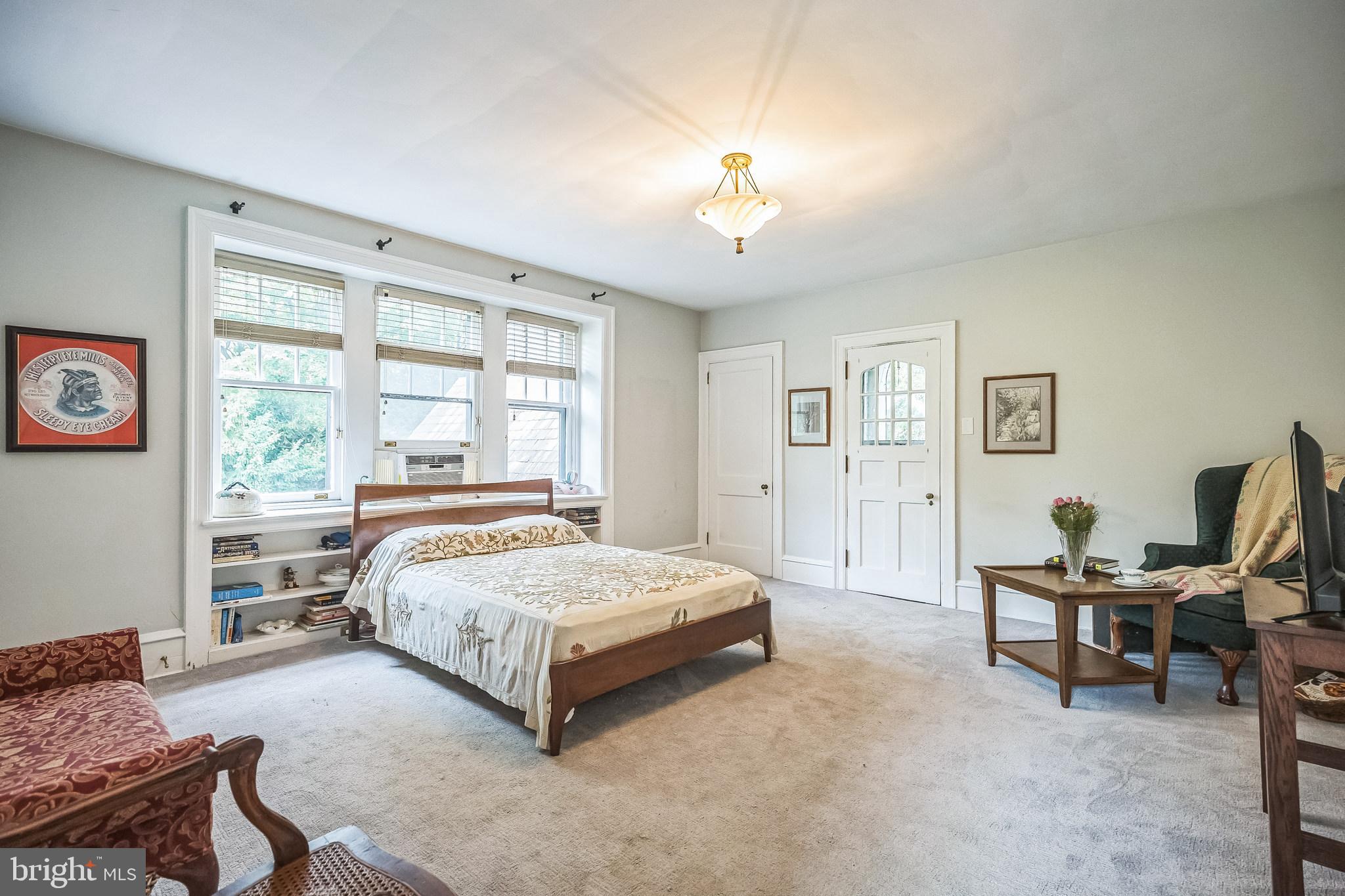 102 Maple Avenue Wyncote, PA 19095 - Photo 18 of 30 a bedroom with a bed and a window