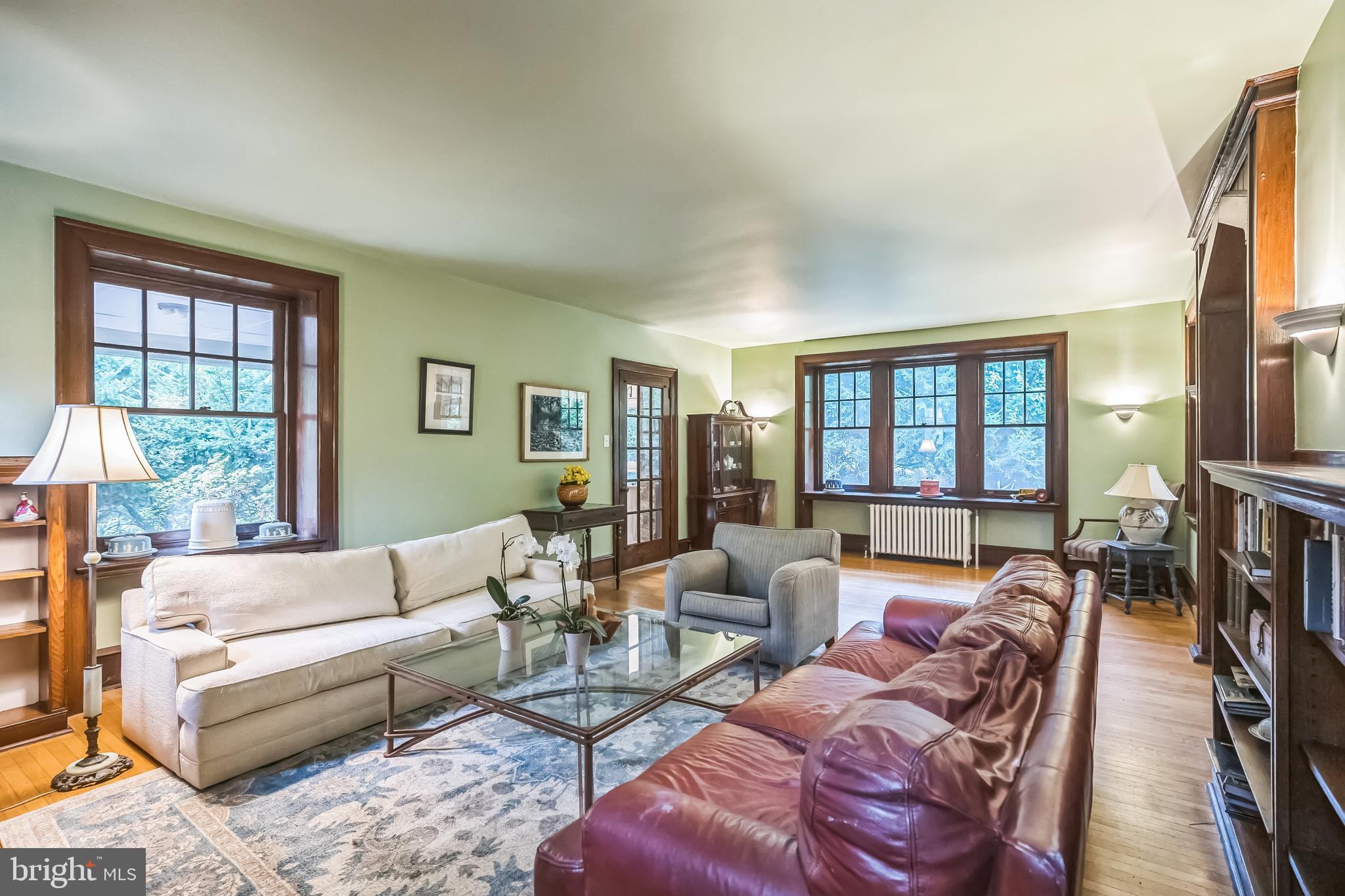 102 Maple Avenue Wyncote, PA 19095 - Photo 5 of 30 a living room with furniture fireplace and a flat screen tv