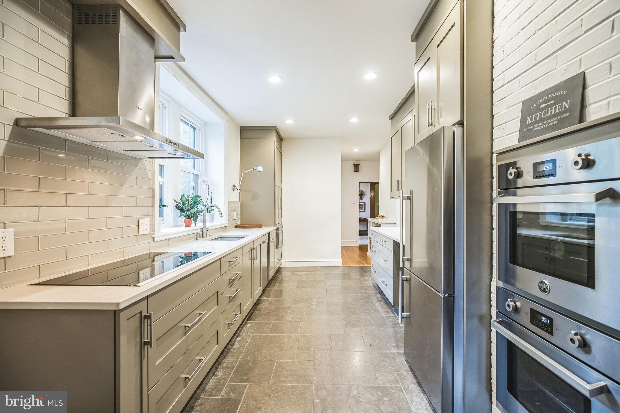 102 Maple Avenue Wyncote, PA 19095 - Photo 7 of 30 a large kitchen with a sink and stainless steel appliances