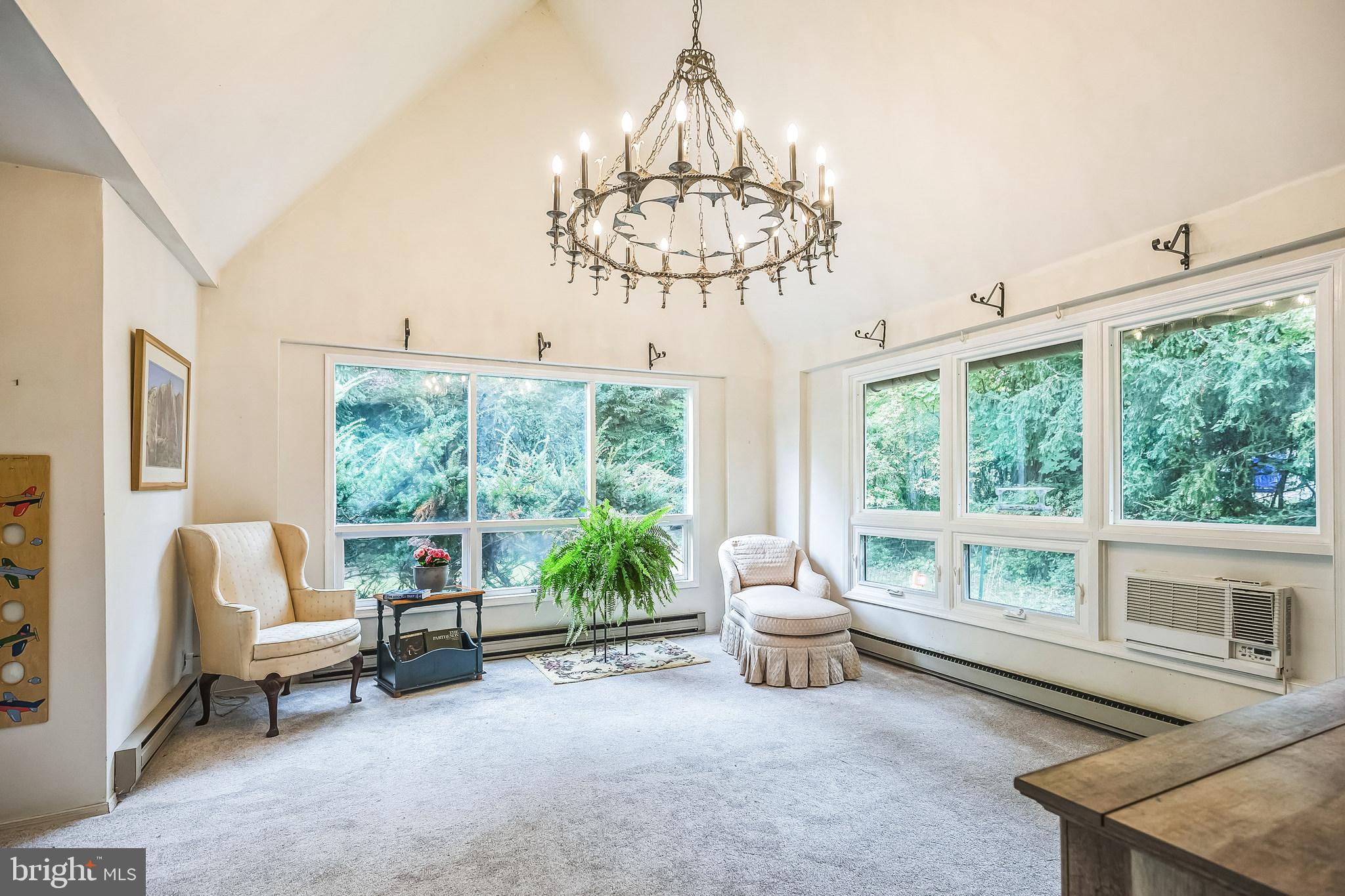 102 Maple Avenue Wyncote, PA 19095 - Photo 10 of 30 a living room with furniture and a chandelier