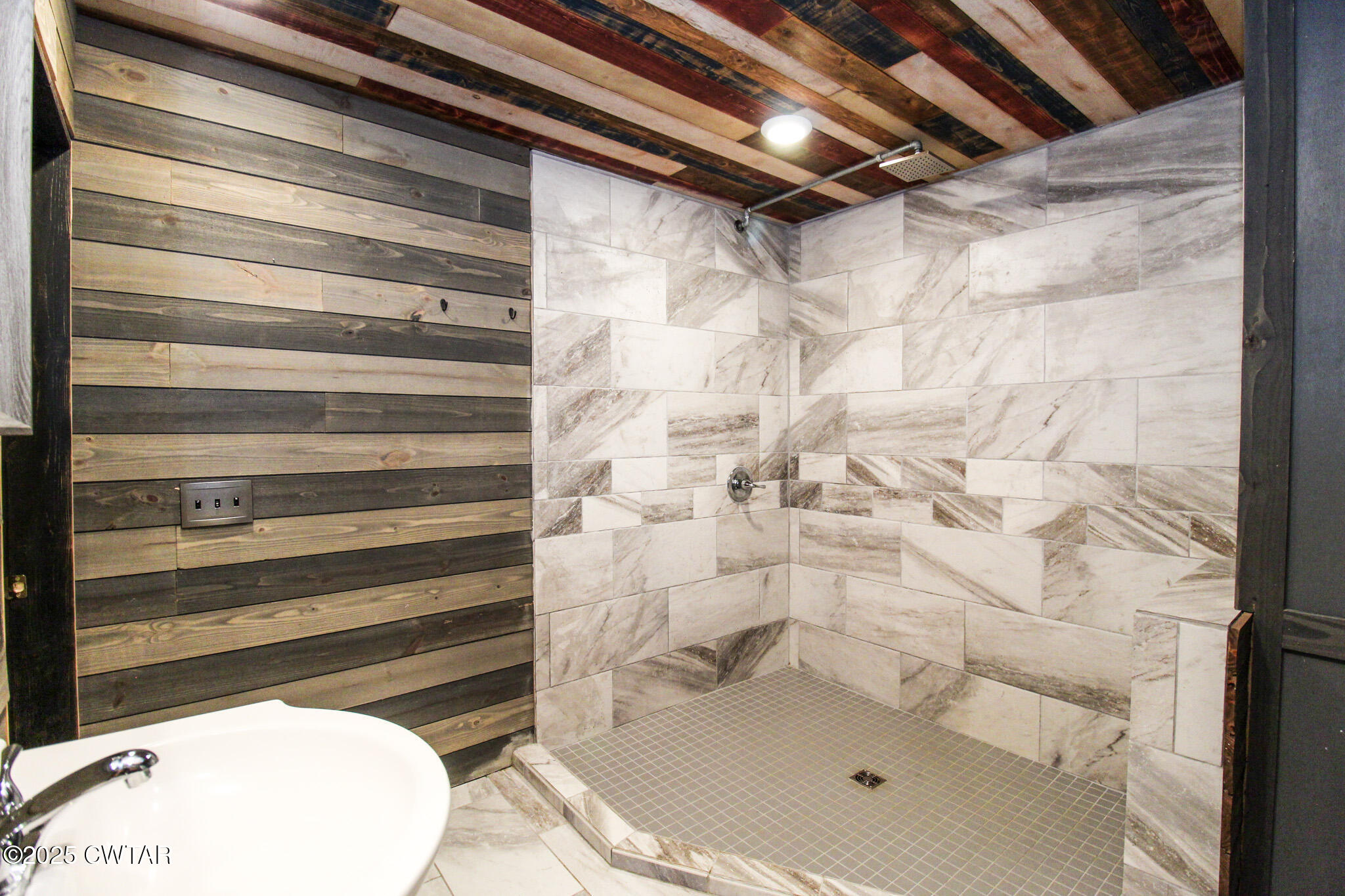 326 Fancy Road Dresden, TN 38225 - Photo 28 of 45 a bathroom with a white bath tub and a shower
