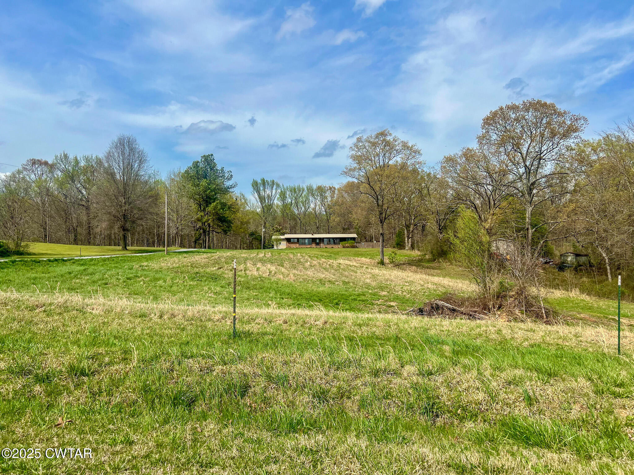 326 Fancy Road Dresden, TN 38225 - Photo 3 of 45 a view of a golf course with a lake