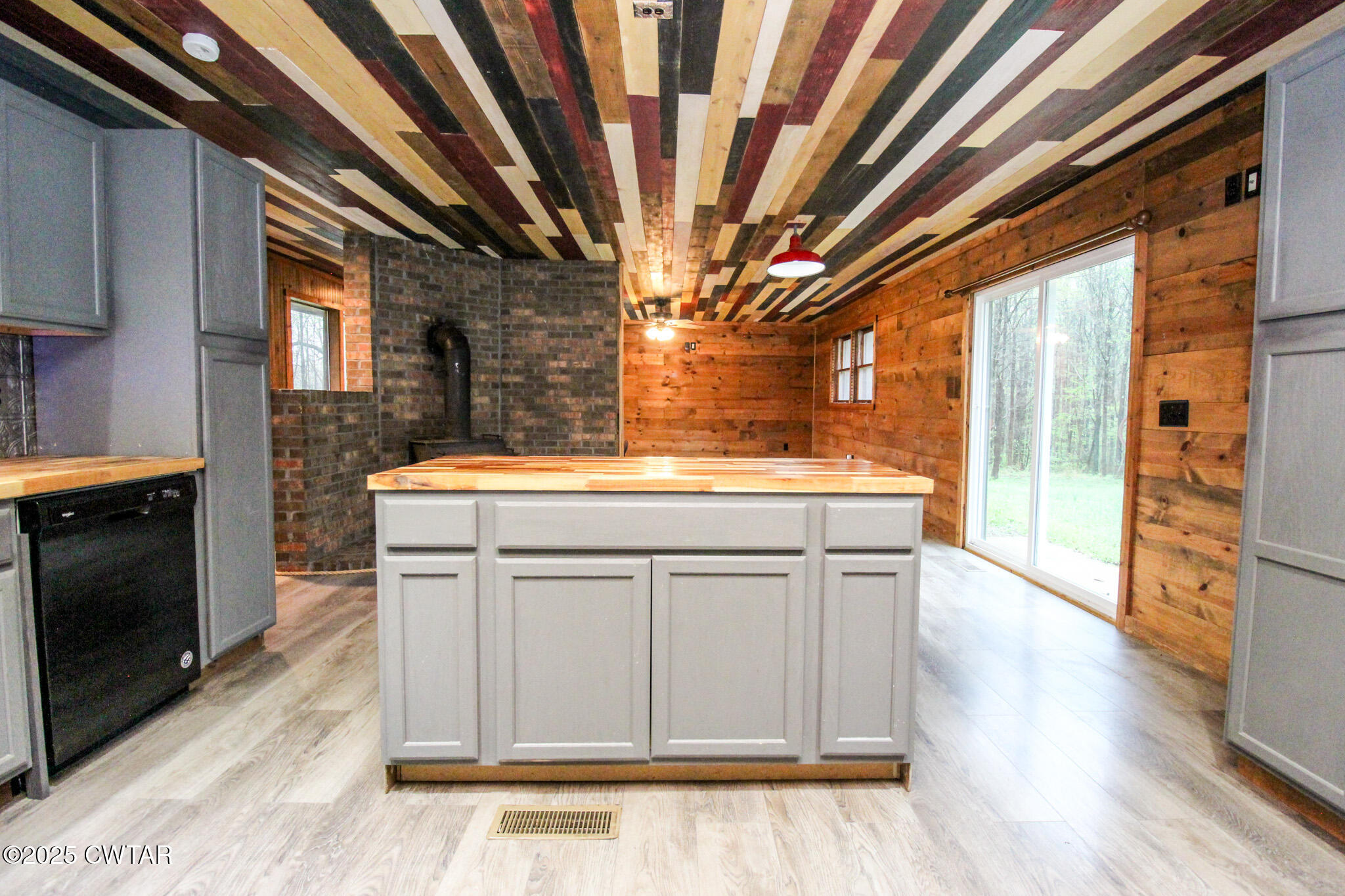 326 Fancy Road Dresden, TN 38225 - Photo 5 of 45 a view of a hallway with wooden floor and a kitchen