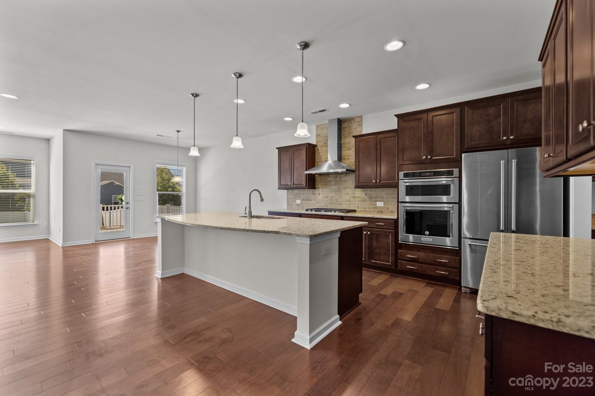 2017 Sugaree Commons Fort Mill, SC 29715 - Photo 19 of 48 a large kitchen with kitchen island a sink stainless steel appliances and cabinets