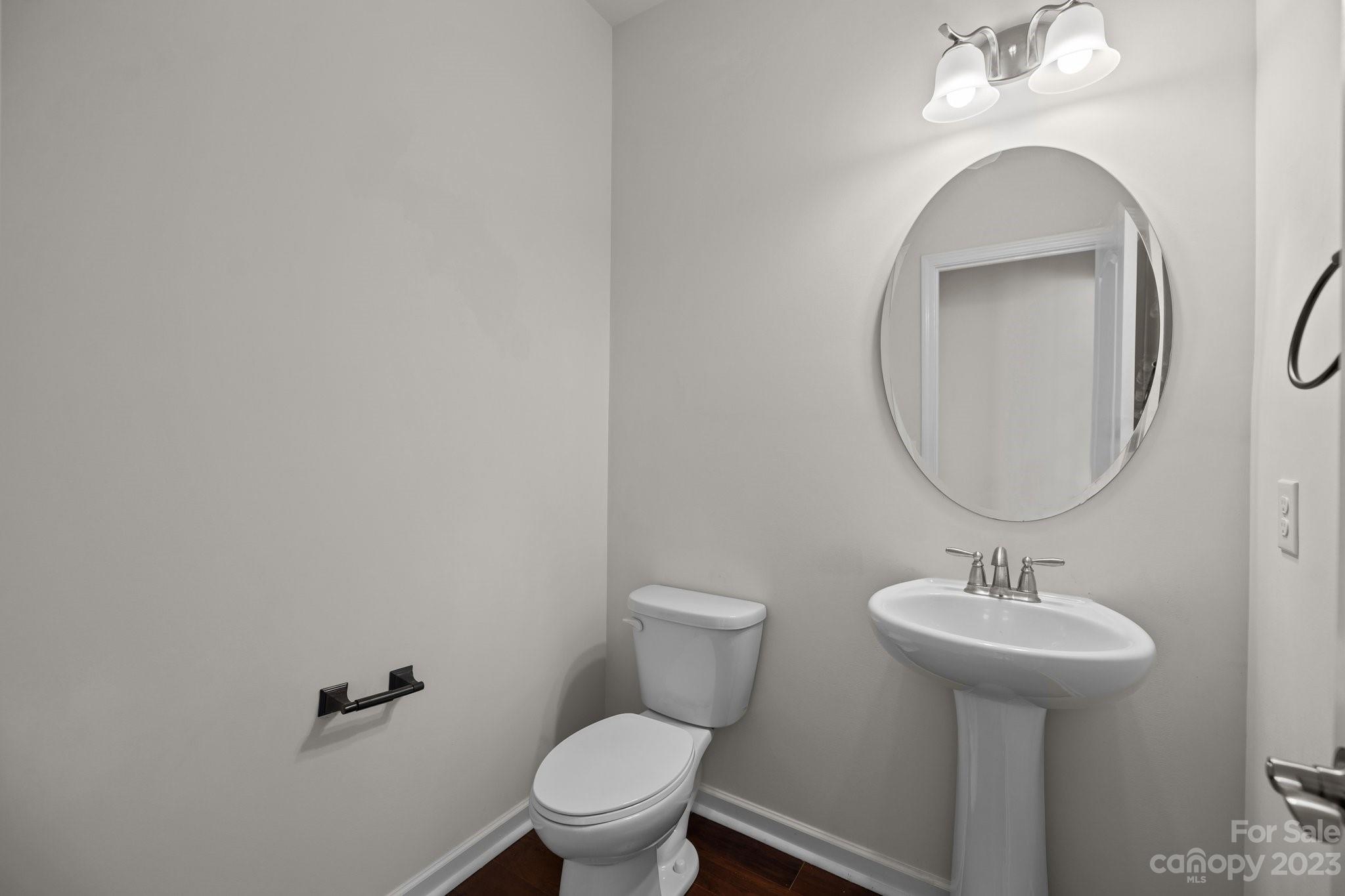 2017 Sugaree Commons Fort Mill, SC 29715 - Photo 20 of 48 a bathroom with a toilet a sink and mirror