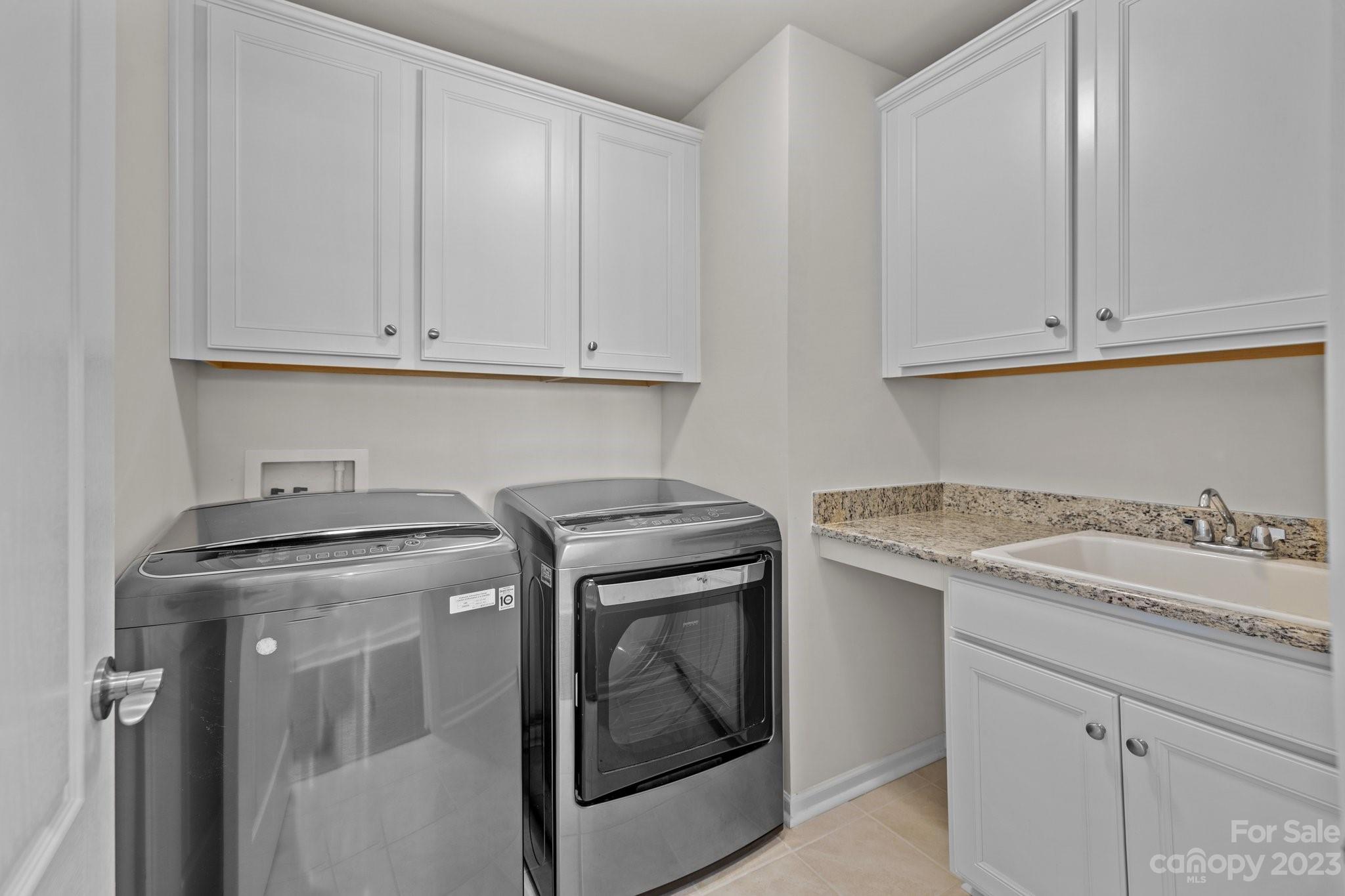 2017 Sugaree Commons Fort Mill, SC 29715 - Photo 25 of 48 a kitchen with granite countertop white cabinets and a stove