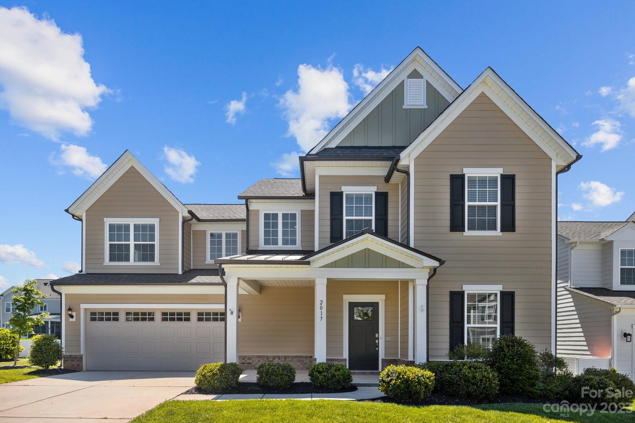 2017 Sugaree Commons Fort Mill, SC 29715 - Photo 3 of 48 a front view of a house with garden