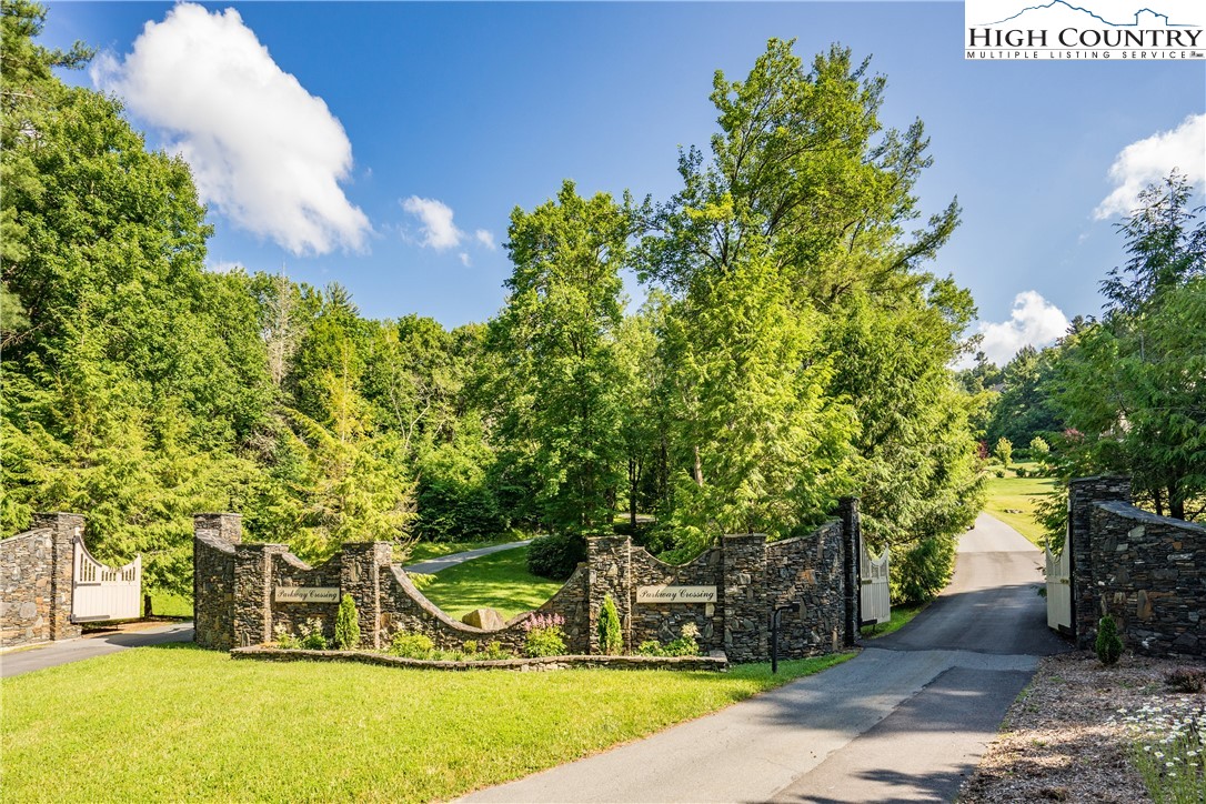 Lot 24 Cielo Road Blowing Rock, NC 28605 - Photo 7 of 16 a view of a yard with table and chairs and a large tree