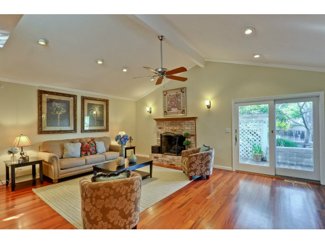 21841 McClellan Road Cupertino, CA 95014 - Photo 11 of 25 a living room with furniture and a fireplace