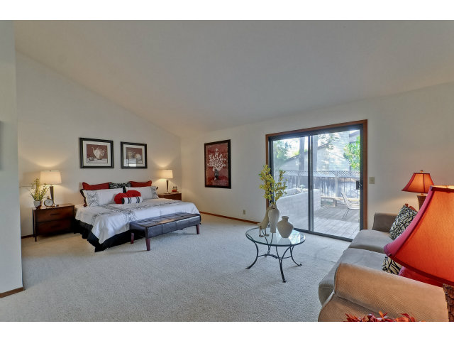 21841 McClellan Road Cupertino, CA 95014 - Photo 14 of 25 a living room with furniture and a large window