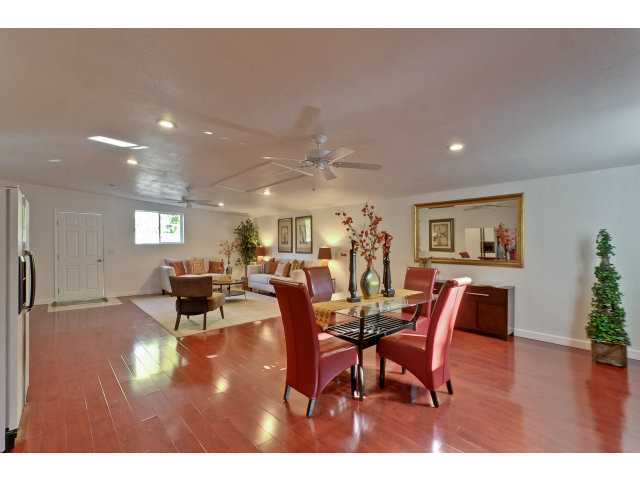 21841 McClellan Road Cupertino, CA 95014 - Photo 16 of 25 a view of a dining room with furniture and wooden floor