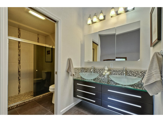 21841 McClellan Road Cupertino, CA 95014 - Photo 17 of 25 a bathroom with a sink and a mirror