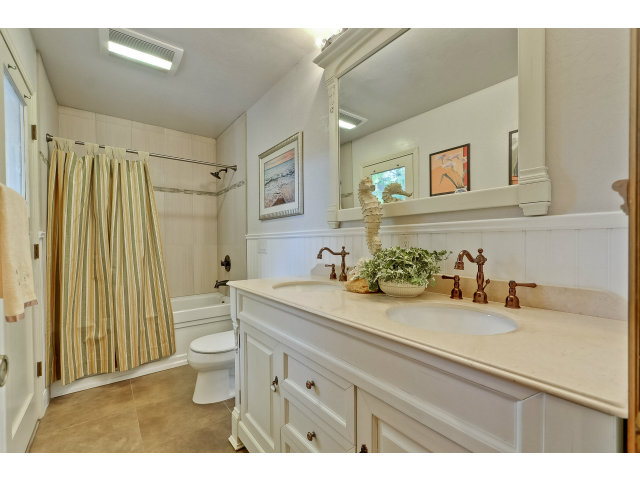 21841 McClellan Road Cupertino, CA 95014 - Photo 20 of 25 a bathroom with a granite countertop sink mirror vanity and toilet