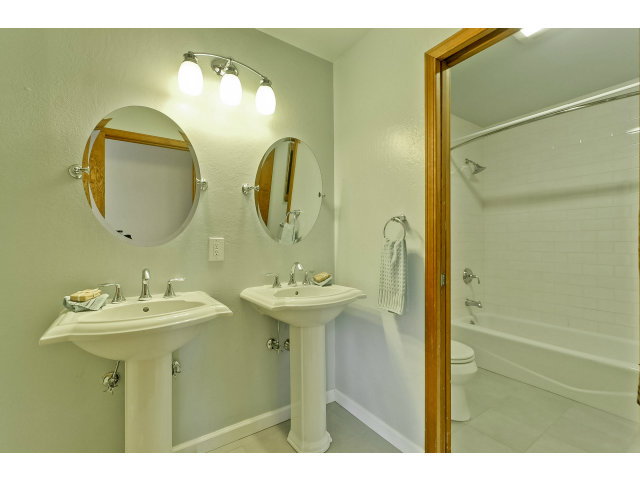 21841 McClellan Road Cupertino, CA 95014 - Photo 22 of 25 a bathroom with a sink and a mirror