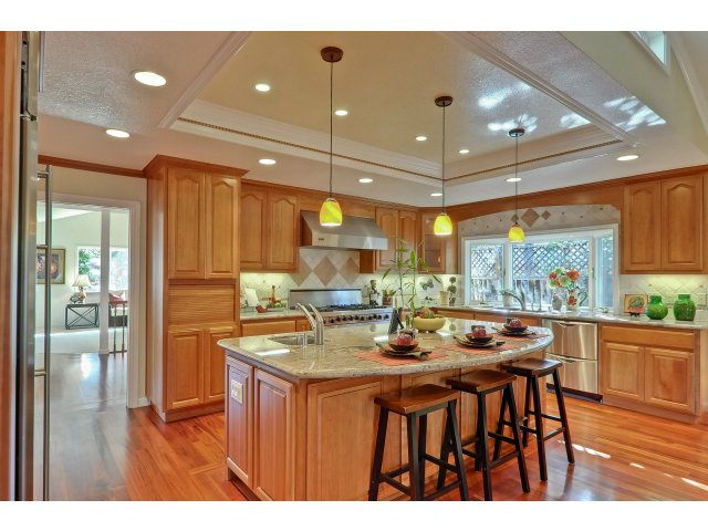 21841 McClellan Road Cupertino, CA 95014 - Photo 9 of 25 a kitchen with a table and chairs