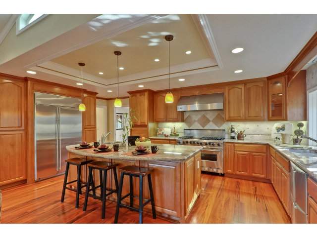 21841 McClellan Road Cupertino, CA 95014 - Photo 10 of 25 a kitchen with lots of counter top space and stainless steel appliances