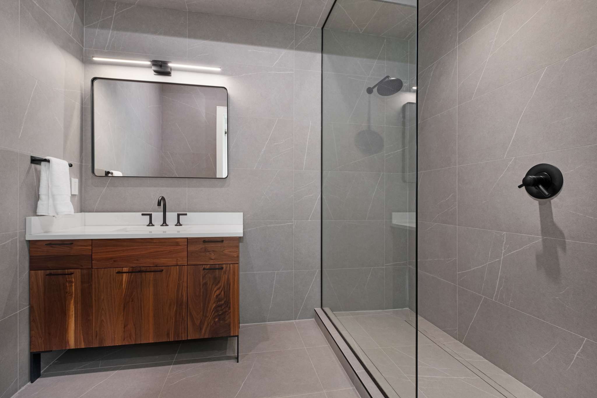 6133 Robin Hill Road Nashville, TN 37205 - Photo 17 of 47 a bathroom with a shower sink and mirror