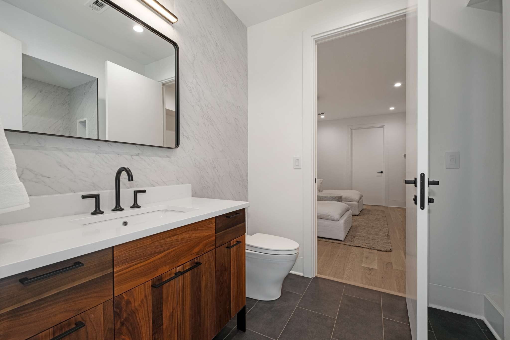 6133 Robin Hill Road Nashville, TN 37205 - Photo 31 of 47 a bathroom with a sink a toilet and a mirror