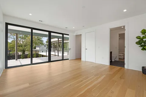 a view of an empty room with a sliding door