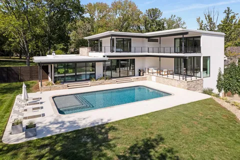 a view of a house with swimming pool