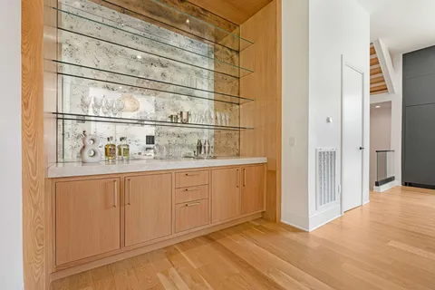 a view of kitchen with white cabinets