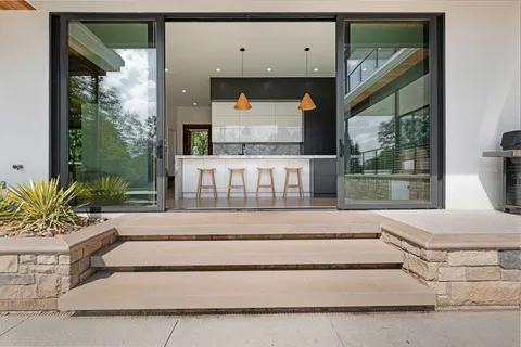 a spacious bedroom with a large bed and a large window