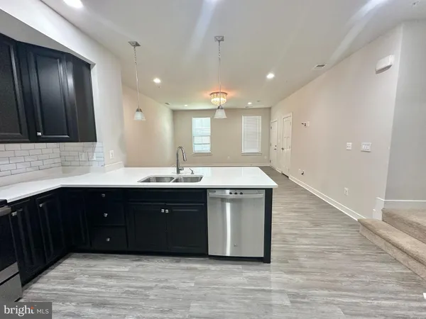 a kitchen with a sink and cabinets
