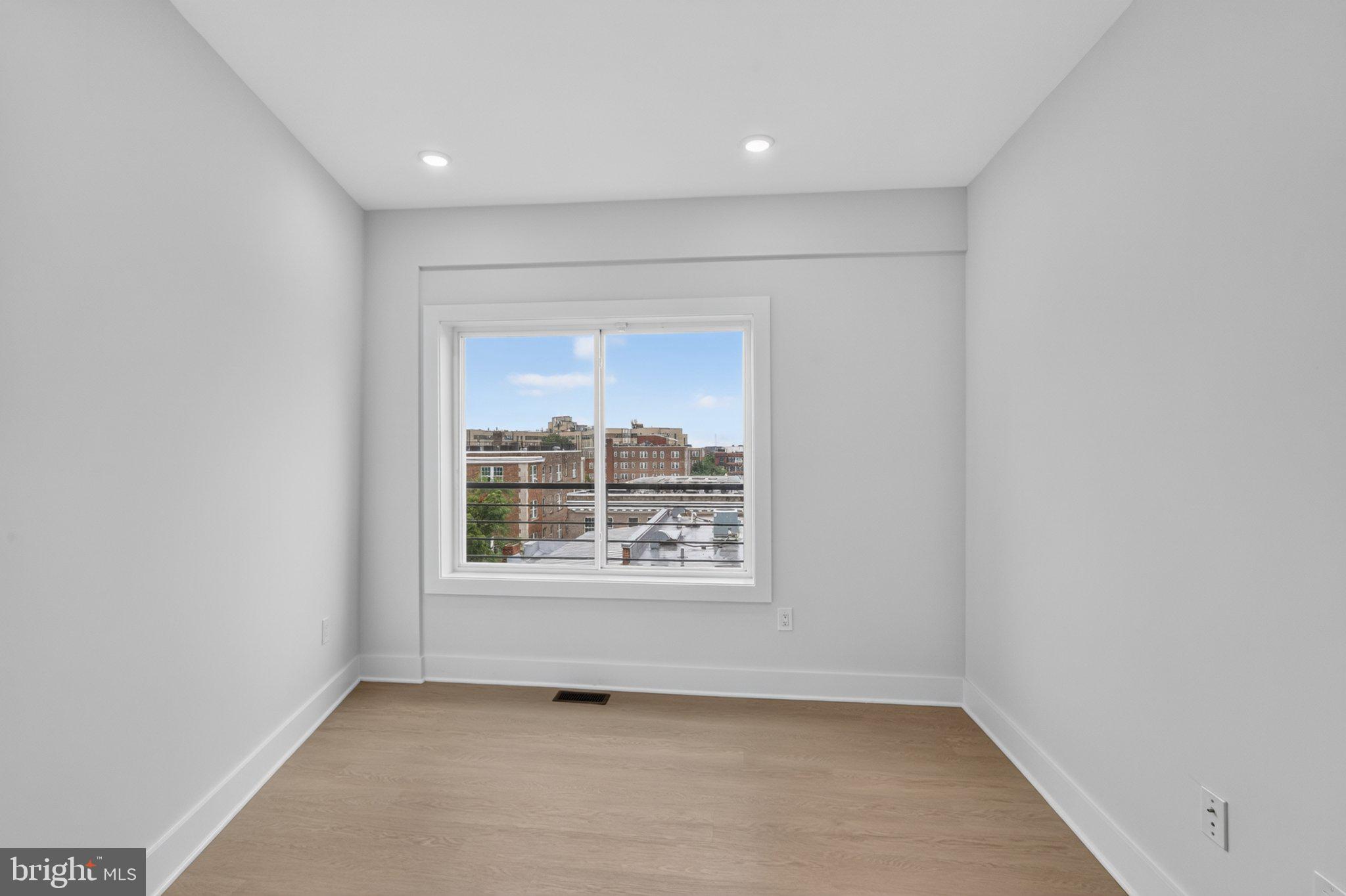 1650 Columbia Road Northwest, Unit 401 Washington, DC 20009 - Photo 18 of 21 Bright and airy urban retreat.