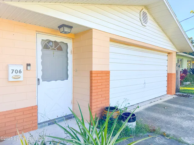 a front view of a house with a garage
