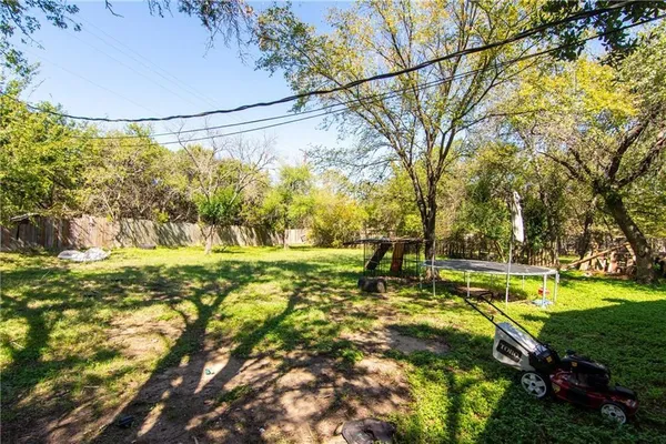 a view of yard with swimming pool