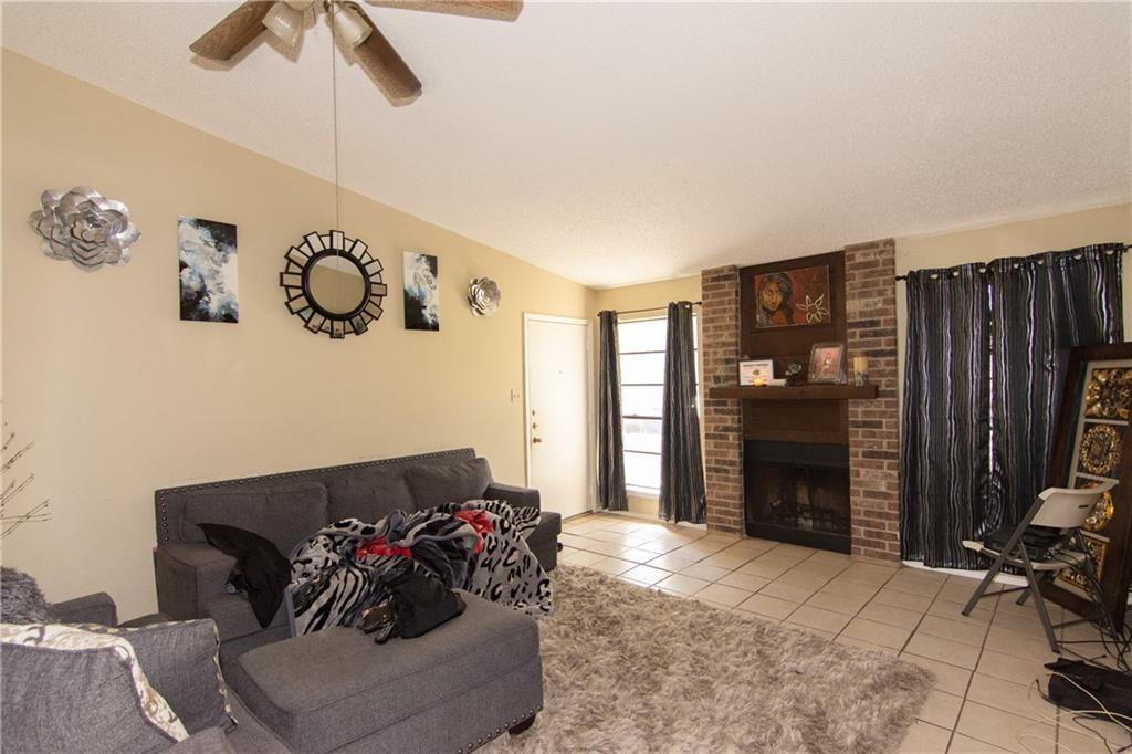 11320 Walnut Ridge Drive, Unit B Austin, TX 78753 - Photo 3 of 12 a living room with furniture and a fireplace