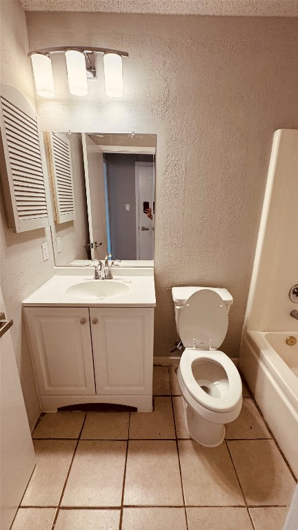 11320 Walnut Ridge Drive, Unit B Austin, TX 78753 - Photo 8 of 12 a bathroom with a toilet sink and mirror
